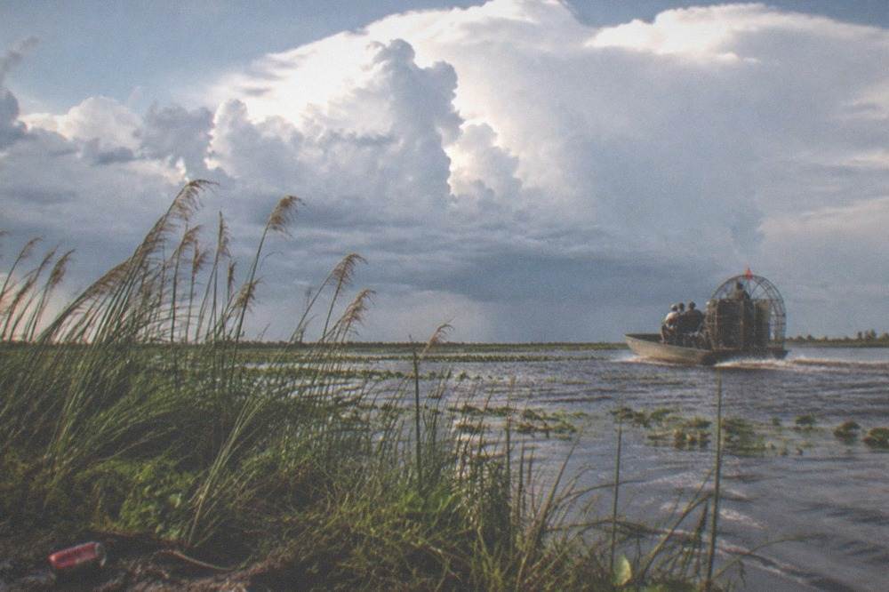 Storm clouds building over a Florida lake in late afternoon